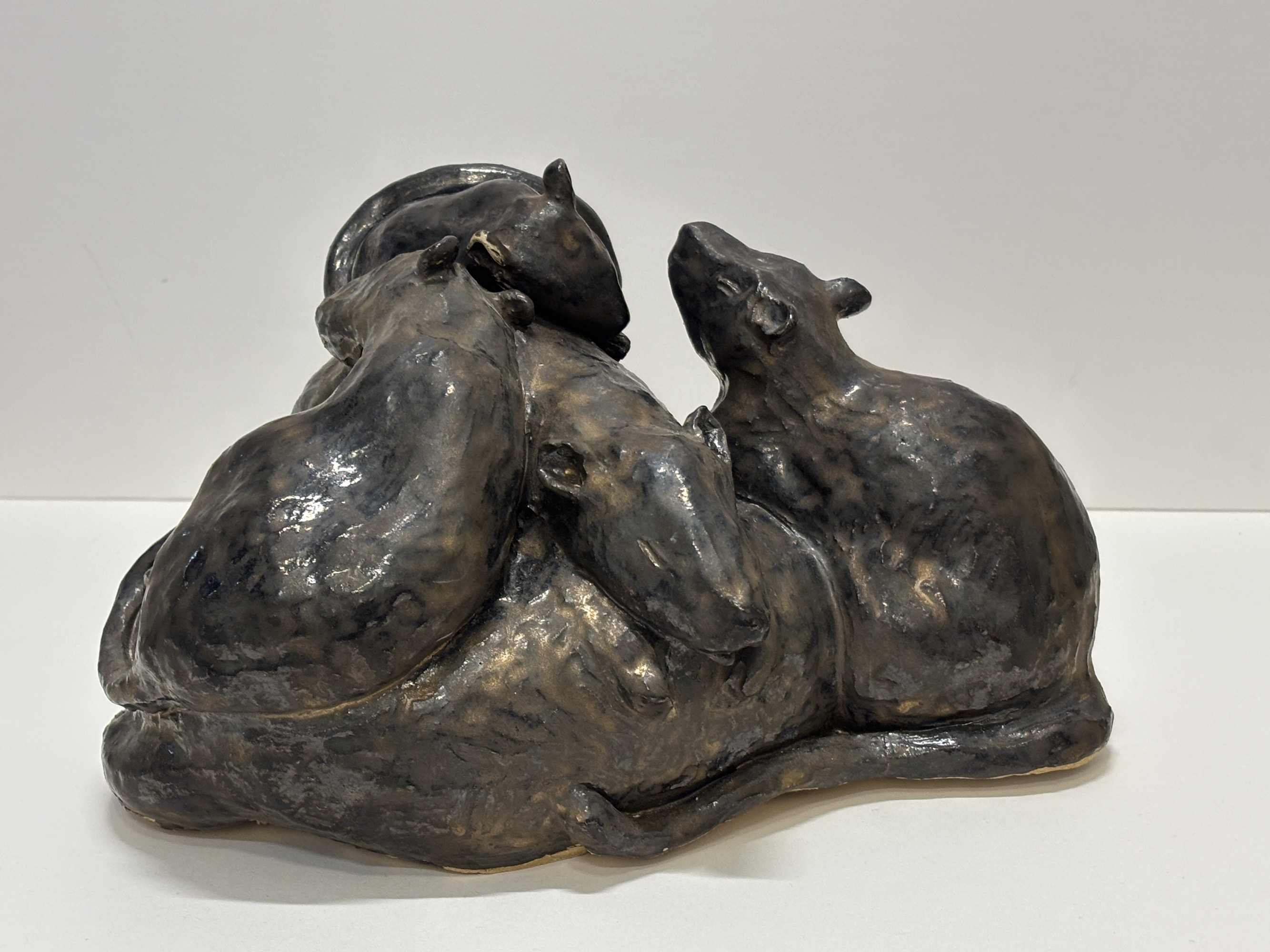 several ceramic rats in a pile as teapot